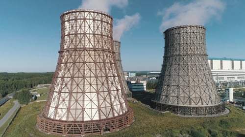 Aerial View on the Working Power Station. Cooling Tower of Nuclear Power Plant. Coal-burning Power