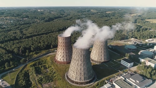 Aerial View on the Working Power Station. Cooling Tower of Nuclear Power Plant. Coal-burning Power