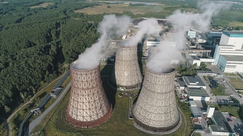 Aerial View on the Working Power Station. Cooling Tower of Nuclear Power Plant. Coal-burning Power