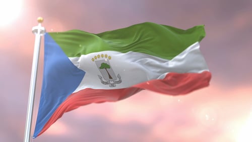 Equatorial Guinea National Flag Waving Loop Against Sunset Sky