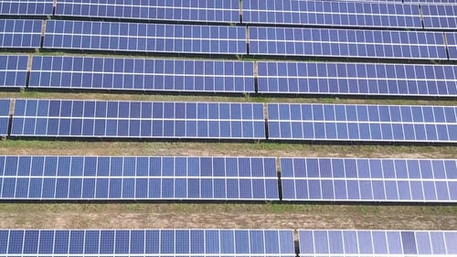 Flying Over the Solar Power Plant with Sun Solar Panels and Sun