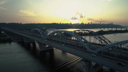 Aerial Footage. Fly Near Kyiv Bridge at Sunset