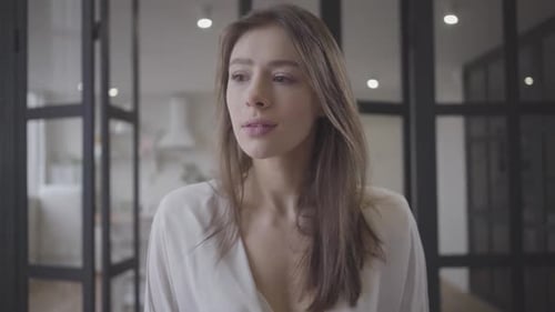 Close-up of Gorgeous Brunette Caucasian Girl Turning To Camera and Smiling. Young Beautiful Woman