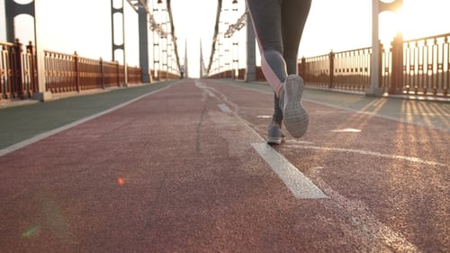 Back View Legs of Runner Female on Bridge