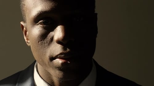 Depressed and Sad Young Black Business Man in Shadow