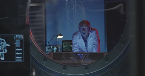 Male Scientist Working in Futuristic Laboratory