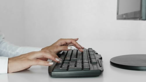 Woman Has Carpal Tunnel Syndrome at Office