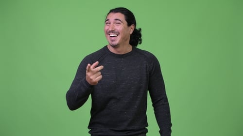 Laughing Man Pointing and Joking Against Green Screen