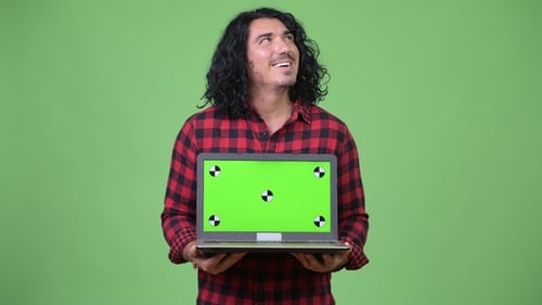 Man Holding Laptop with Green Screen