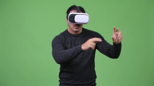 Man Using VR Headset with Hand Gestures
