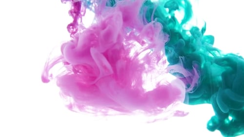 Multicolored Ink Flow in Water Green and Pink Swirl Paint in Water on a White Background