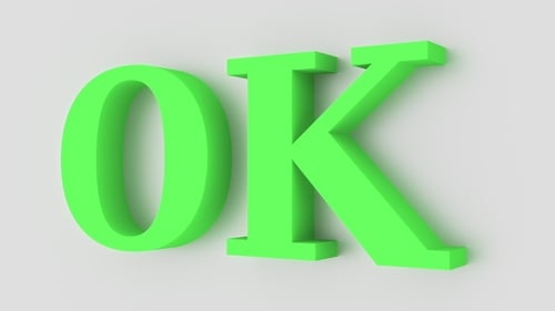 Green Word OK Pops Up From the Wall