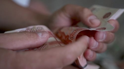 View of a Male Hands Counting Many Russian Rubles