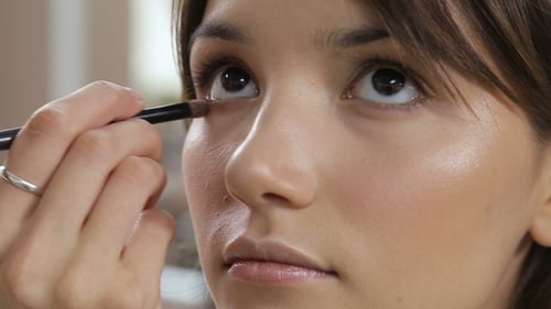Young Woman Receiving Eye Makeup Close Up
