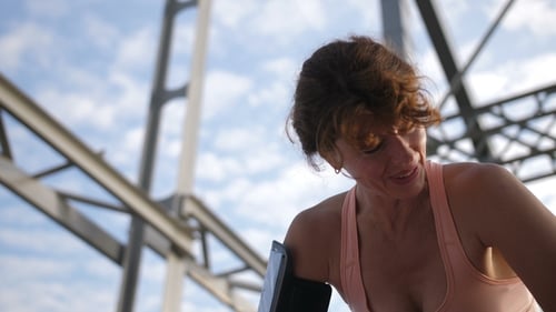 Portrait of Senior Female Breathing After Running
