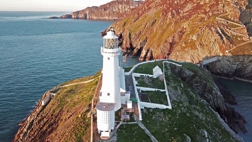 Aerial View of South Stack with Lighthouse and Cliffs During Sunset