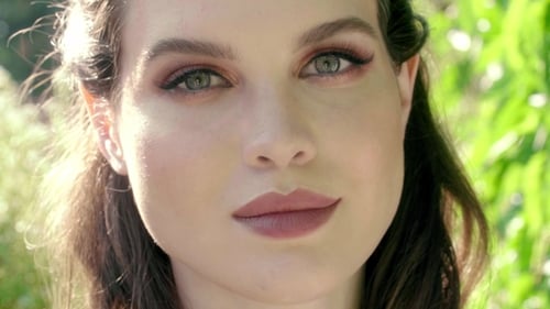 Elegant Woman Posing Outdoors in Natural Light