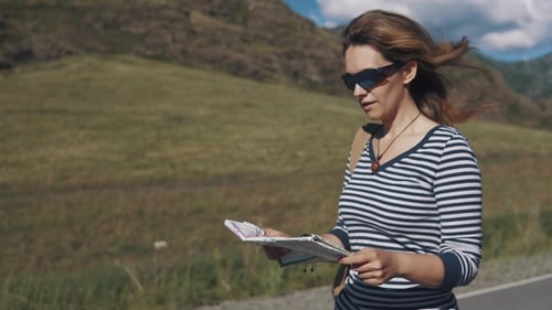 Woman with Map Exploring the Countryside