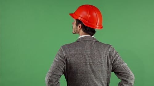 Rear View Shot of a Contactor Wearing Hardhat Looking Around on Chromakey