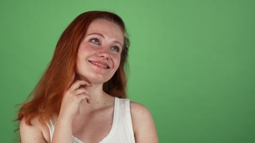 Smiling Woman with Auburn Hair on Green Screen
