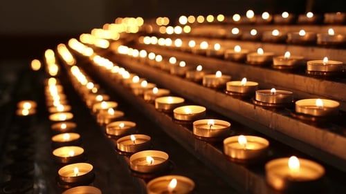 Lighted Candles in the Temple in the Twilight