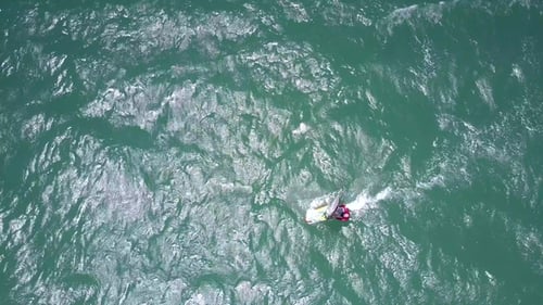 Surfer Rides Gleaming Azure Ocean Waves