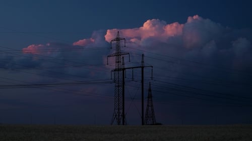 Electrical Towers in Field at Twilight