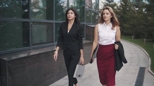 Confident Business Women Walking Down the Street