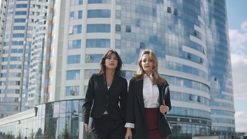 Confident Business Women Walking Down the Street