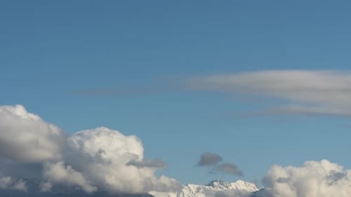 Thick Clouds Swirling Over Mountain Range
