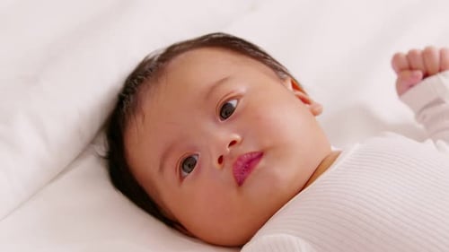 Baby Looks Towards Camera in Close Up
