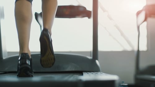 Pretty Girl Jogging in Gym
