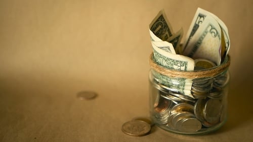 Close up shot of jar full of money