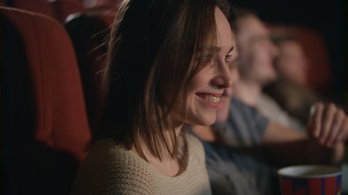 Smiling Woman Watching Movie. Romantic Couple Watch Comedy Film