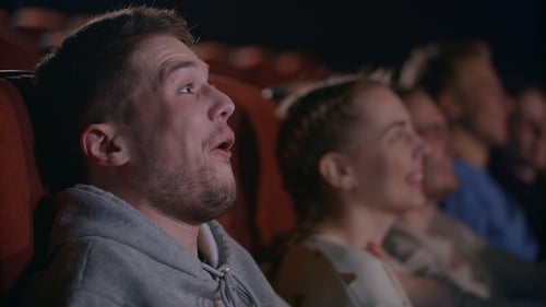 Man Laughing at Comedy Film. Male Emotion at Movie Entertainment