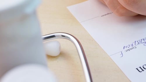 Doctor Hand Writing Rx Prescription List To Patient