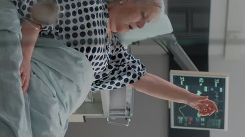 Medical Team Assists Senior Woman With Oxygen Mask