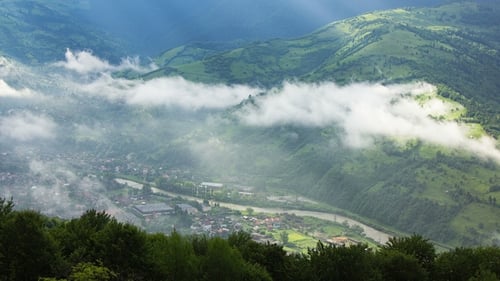 Timelapsed Scenery with Mountain Peaks and Cloudy Sky