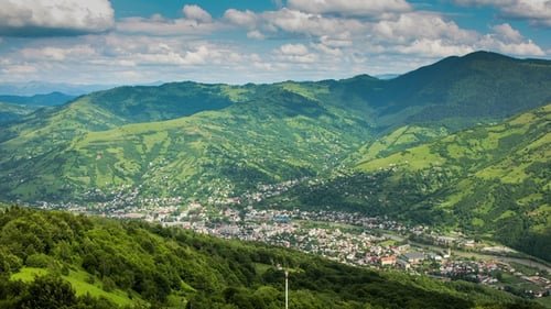 Timelapsed Scenery with Mountain Peaks and Cloudy Sky