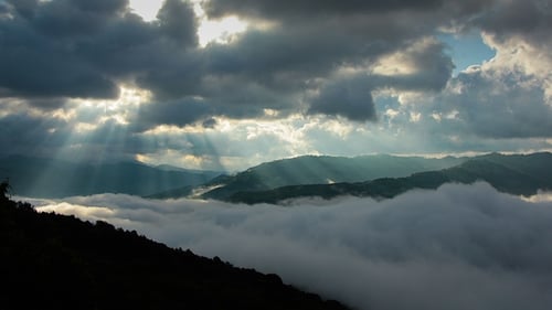 Timelapsed Scenery with Mountain Peaks and Cloudy Sky