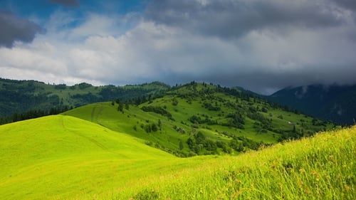 Timelapsed Scenery with Mountain Peaks and Cloudy Sky