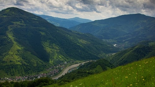 Timelapsed Scenery with Mountain Peaks and Cloudy Sky