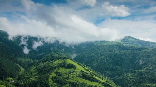 Timelapsed Scenery with Mountain Peaks and Cloudy Sky