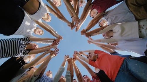 College Students Teamwork Stacking Hand Concept. Nineteen Friends.