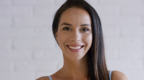 Woman Smiles While Posing in a Beauty Portrait
