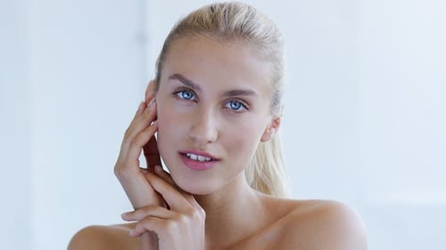 Beautiful Woman Posing with Hands on Face