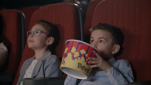 Children Watching Movies in Cinema. Movie Entertainment for Kids