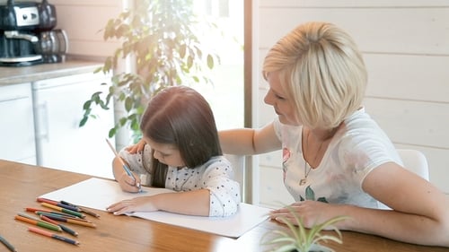 Mother and Daughter Drawing Together at Home