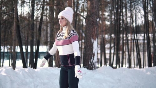 Skating. Young Woman Enjoys Skating on a Rink in the Winter Forest