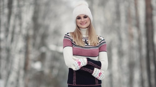 Cute Girl in Winter Forest Smiling and Posing at Camera